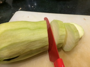 Slicing eggplant, half inch thick